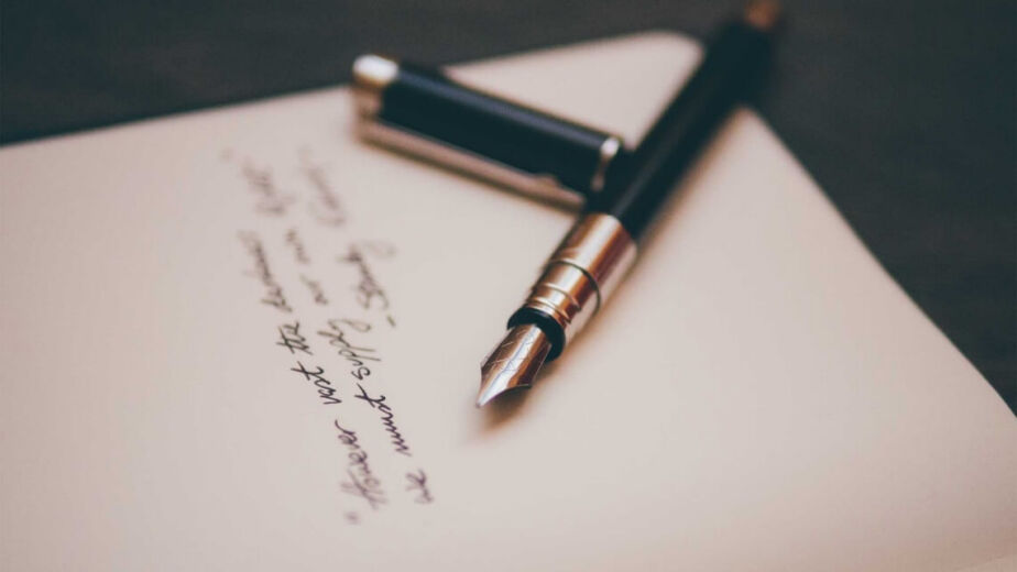 A pen resting on a written document